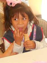 Maria enjoying her school lunch