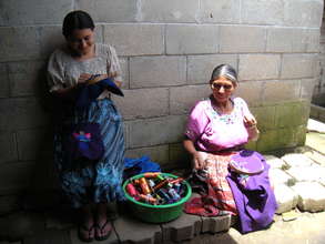 Clara and her daughter make blouses to sell
