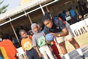 Kids and our Ms Ebere, learning the basics