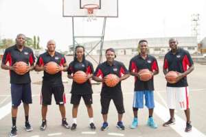 Volunteers Coaches on head to teach the kids