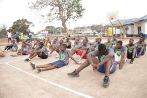 Kids listening to some advice from Coaches