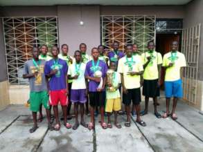 Kids displaying there medals .