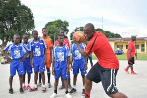 Coach Harrison teaching the boys some basic moves