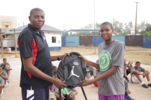 Coach Chiedozie with one of our winners