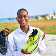 Audu  excited about his new shoe.