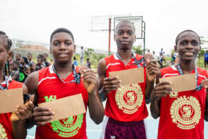 Winners with envelopes containing their present.