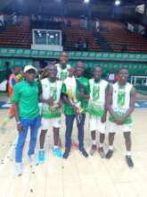 Gold medalist with the championship trophy.