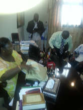 GGM staff presenting funds to the First Lady