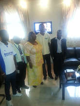 GGM staff presenting funds to the First Lady