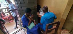 Eye Testing In Progress While Others Wait