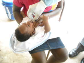 Baby getting medicine