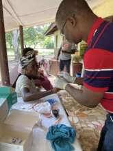 Lab Techician Performing Sugar Test on Patients