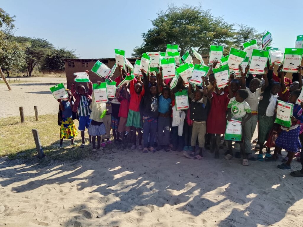 School children receive mosquito nets