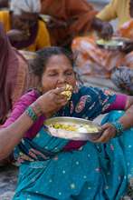 destitute older person having food