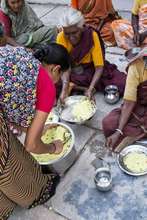 serving hot meals to destitute oldage women