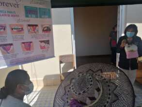 Beba's attentive student has wide-brimmed hat