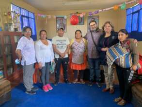 Bebe and Alejandro with parents at school meeting