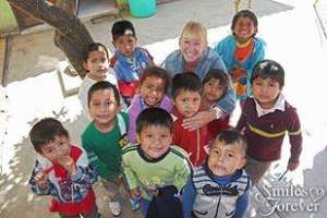Smiles Forever Founder Sandy with lucky children