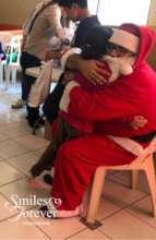 Santa giving Christmas hug