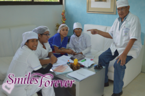 Smiles Forever students studying with elder