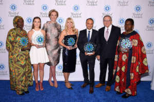 Sandy Kemper (center) World of Children Award