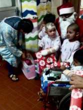 Brave little child in wheelchair with his friends