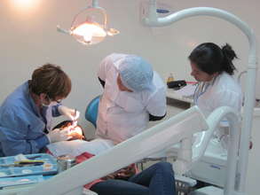 Dental Hygiene students look on.