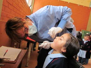 Dental exams in a small school room in Morachata