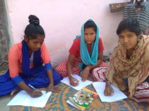 Young women conducting survey for action project