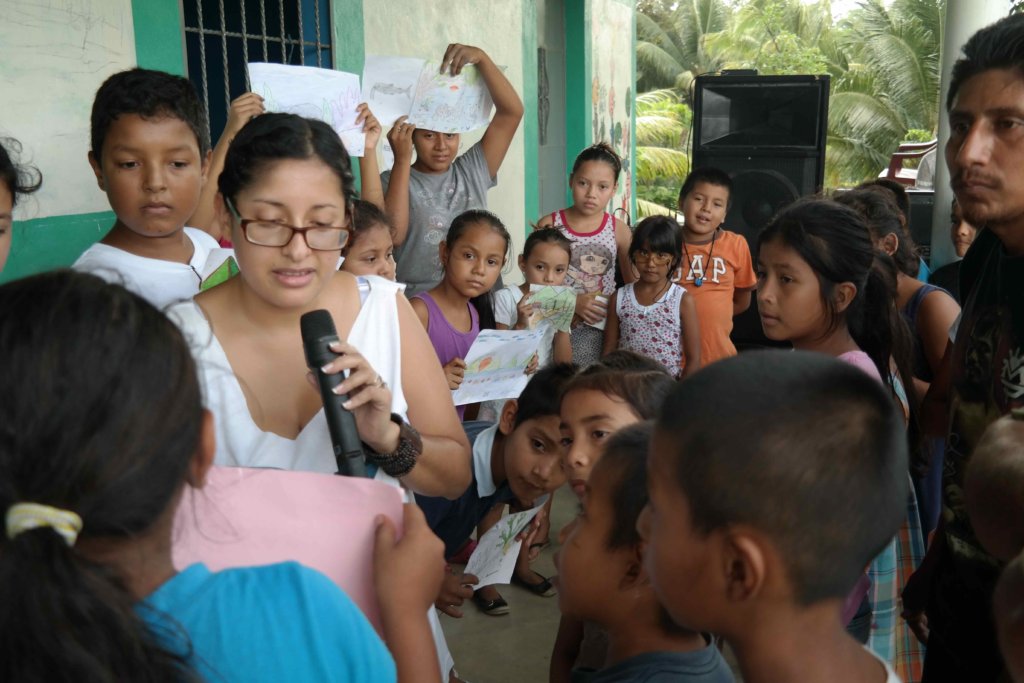 FUNDAECO staff Griselda with student drawings