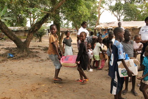 Ebola survivor children happily collect food