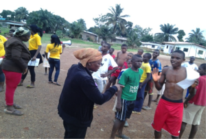Vaibah speaks with youth soccer players about EBV.