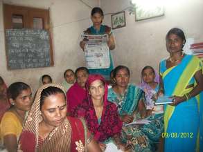 Adult Literacy Centre- women reading newpapers