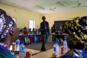 Women's association discussing causes of Ebola