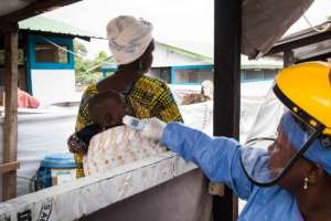 Screening patients at a Guinea hospital
