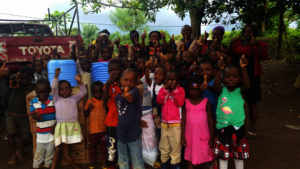 Children happy with gifts donated by REO