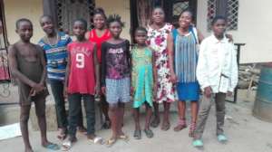 Children pose with Founder during an event
