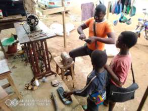 children in tailoring workshop