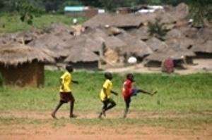 Boys participating in a TKL football activity in