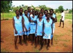 Winning netball team holding their trophy in Kitgu