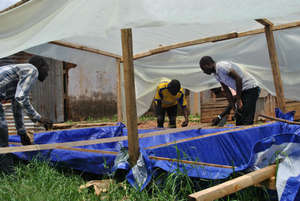 Orphanage staff building the Spirulina pool