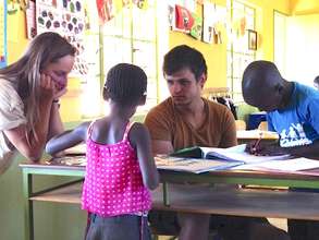 Coco doing homework with our kids