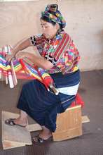 Weaver rocking the bench in Cajola, Guatemala