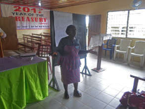 Miatta giving remarks (Church Aid Liberia)
