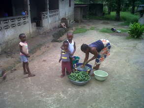 Washing cucumbers in Liberia.
