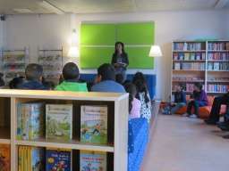 Kiziltepe reading to children at the library