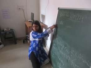 Deepika teaching photography to the girls
