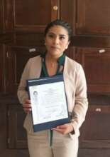 Gabriela with her professional license in 2016