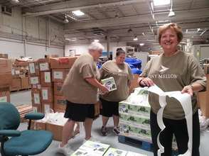 Volunteers helping to build pallets for shipping