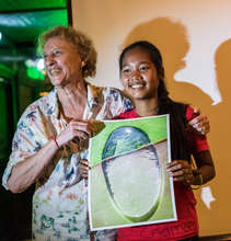 A Student Receives a Print of Her Work